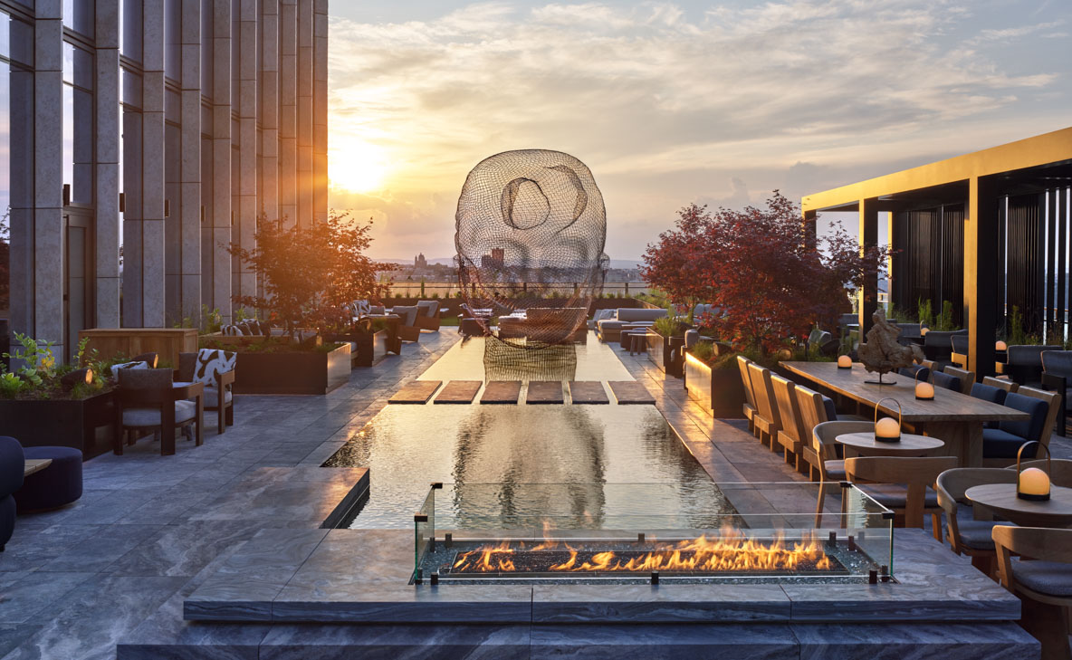 Electric Lemon Terrace with sculpture by Jaume Plensa